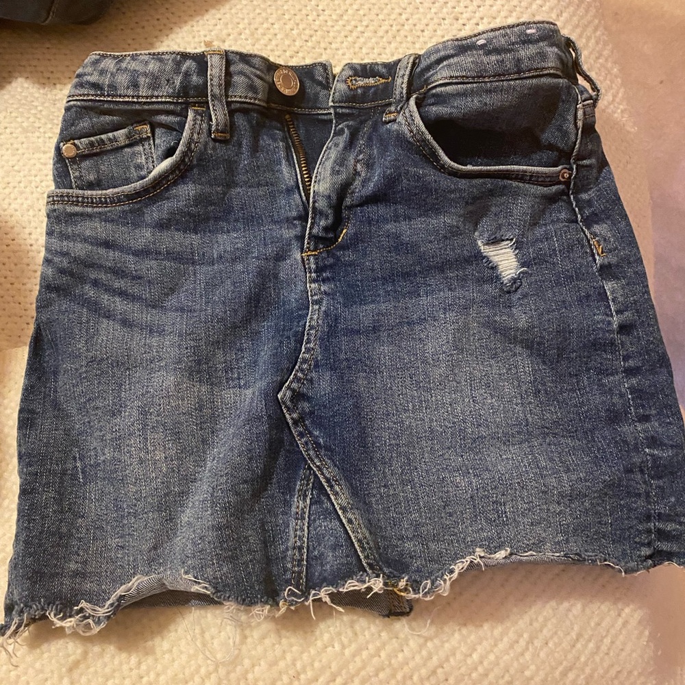 H&M denim skirt. This skirt is open at the bottom.